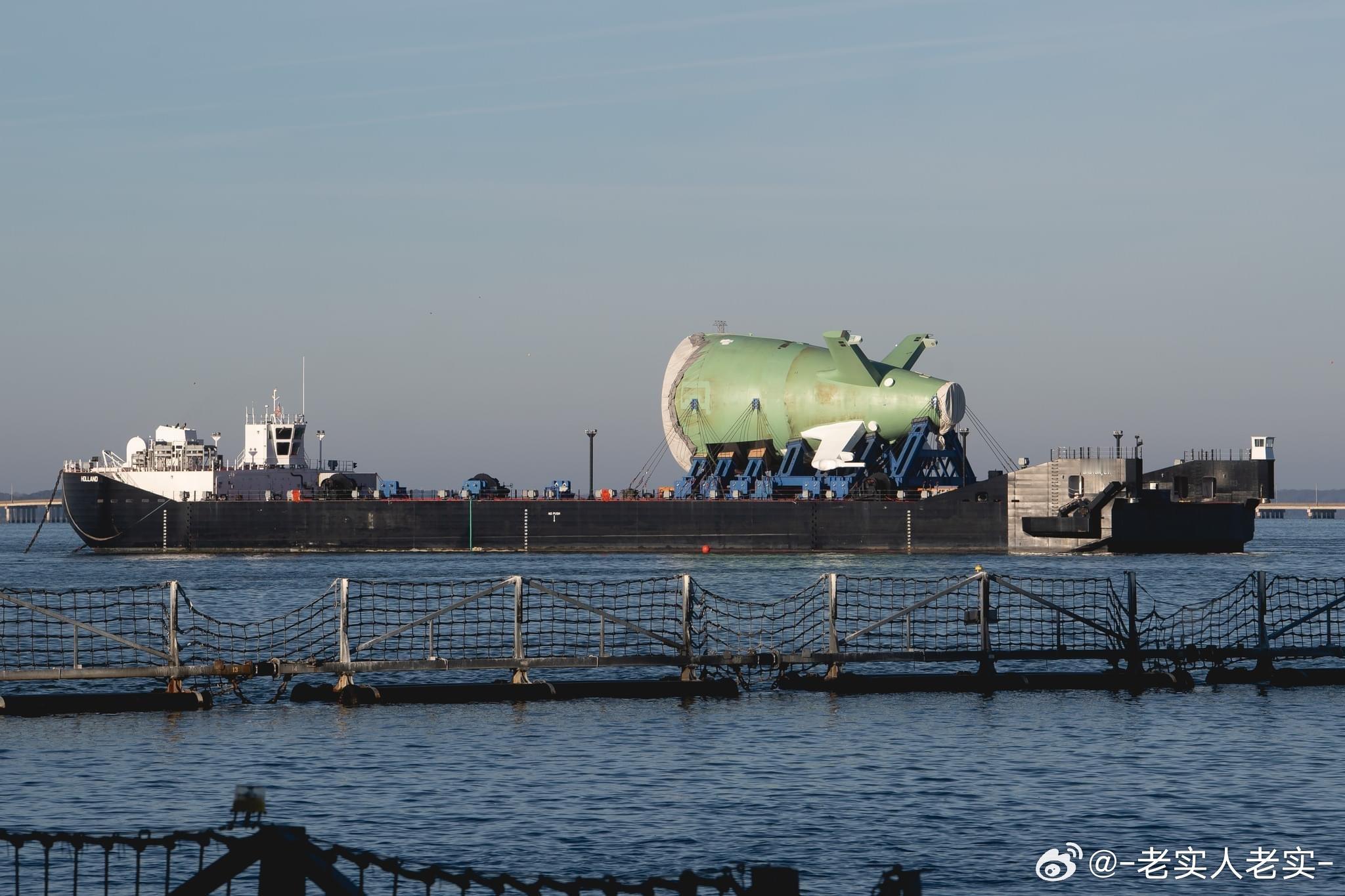 新一代战略核潜艇哥伦比亚号的艇尾分段从纽波特纽斯海军船厂启程，运往通用动力舰船分