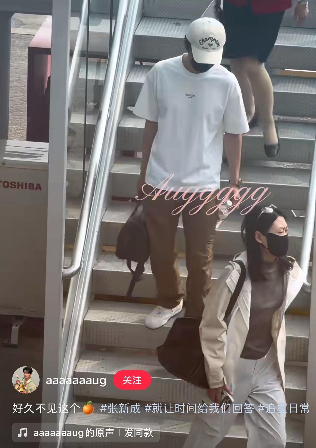 手握娃哈哈矿泉水的直男穿搭的小哥哥， ​​​