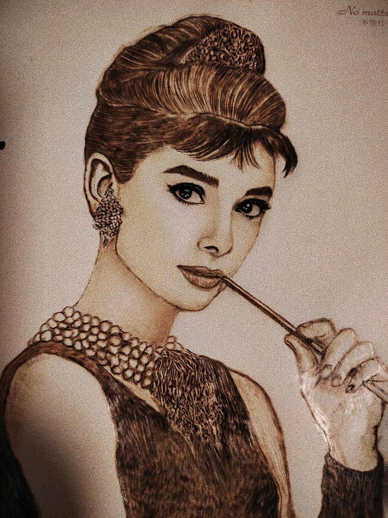 烙画人物肖像。