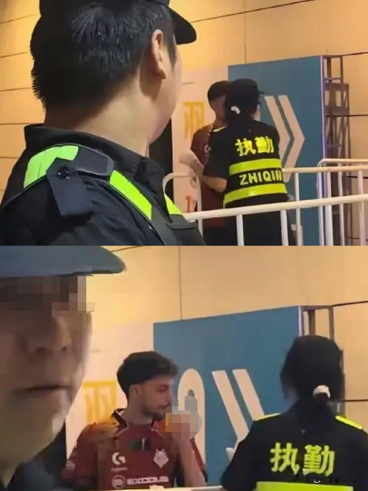 女安保笑着给外国选手点烟，还是在禁烟通道。

9月14日，上海梅奔文化中心CS赛