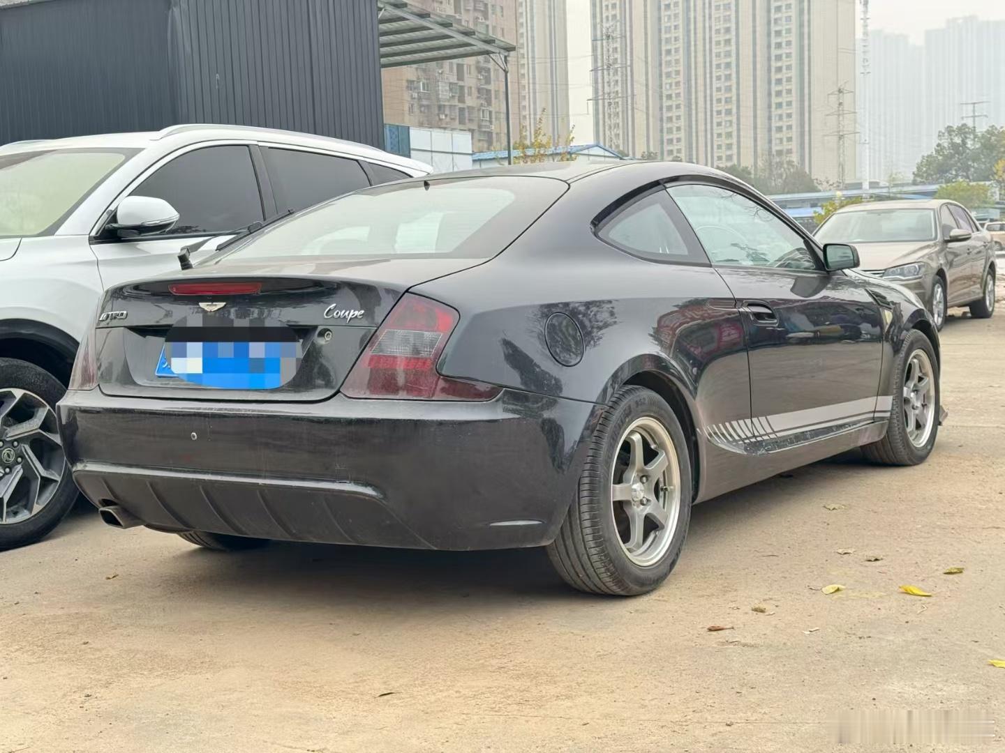 好有回忆感的车啊 这应该是跟吉利美人豹同时期的国产两门跑车了 有认识的吗 武汉·