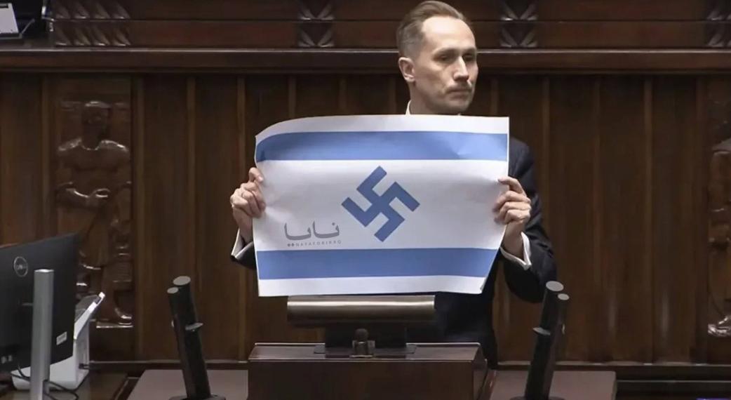 波兰议员公然篡改以色列国旗！

4 月 14 日，波兰众议院例行会议上，极右翼议