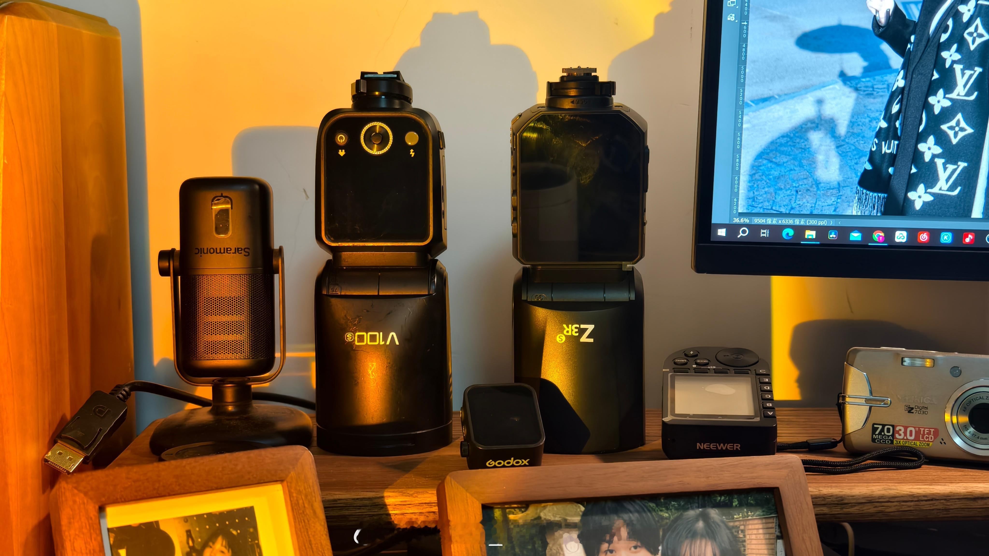 同样100w，纽尔z3r体积重量稍大一些，换来的是屏幕比神牛v100大，但是操控