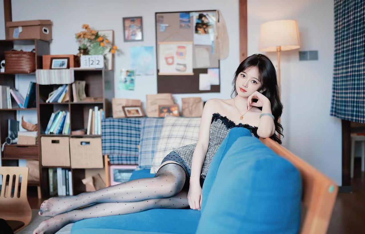 《晴窗懒意》
蓝榻晴光半日闲，香凝罗袜点轻斑。
朱唇微漾春心暖，懒倚芳丛意自安。