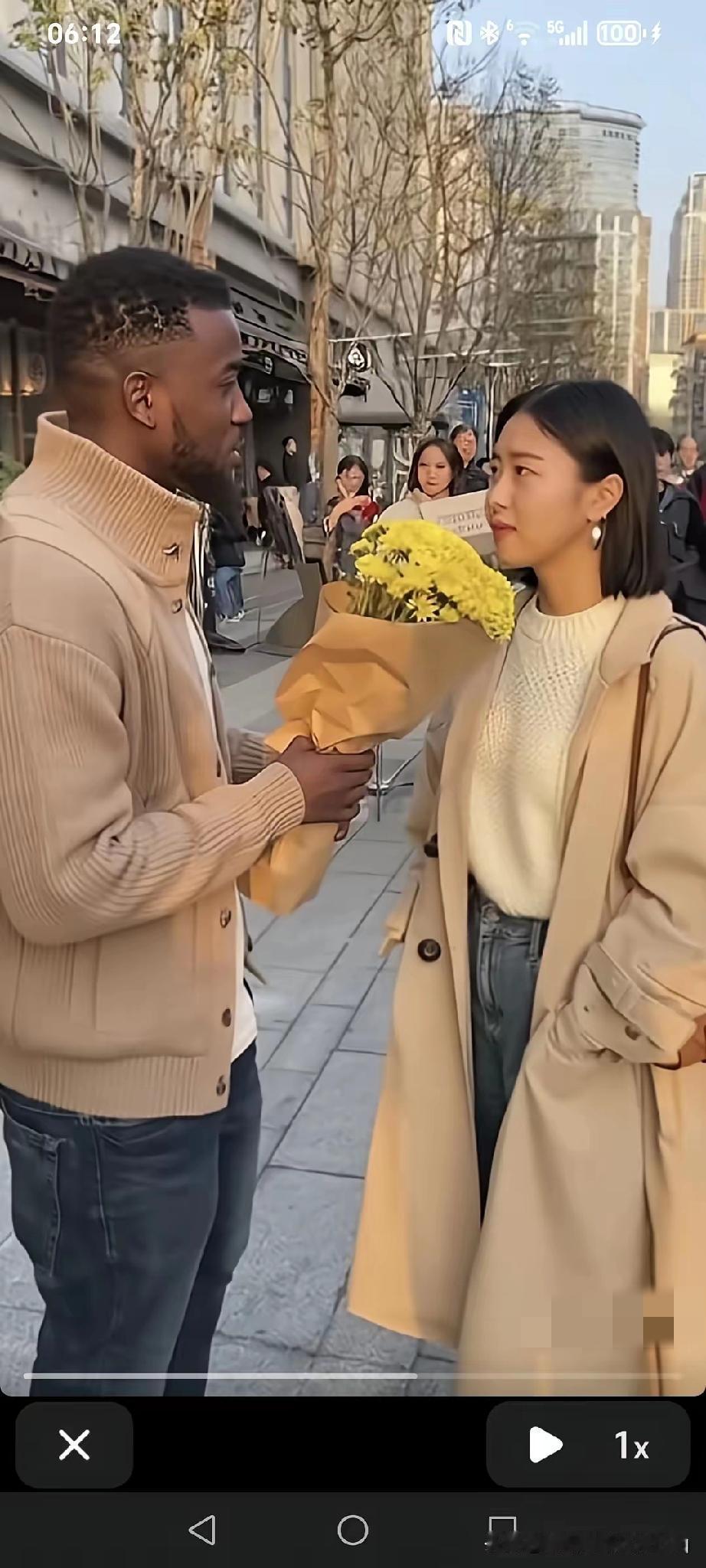 街上一个异国男子手捧鲜花向女子表白:“你愿意做我女朋友吗？”女子严肃的说:“抱歉