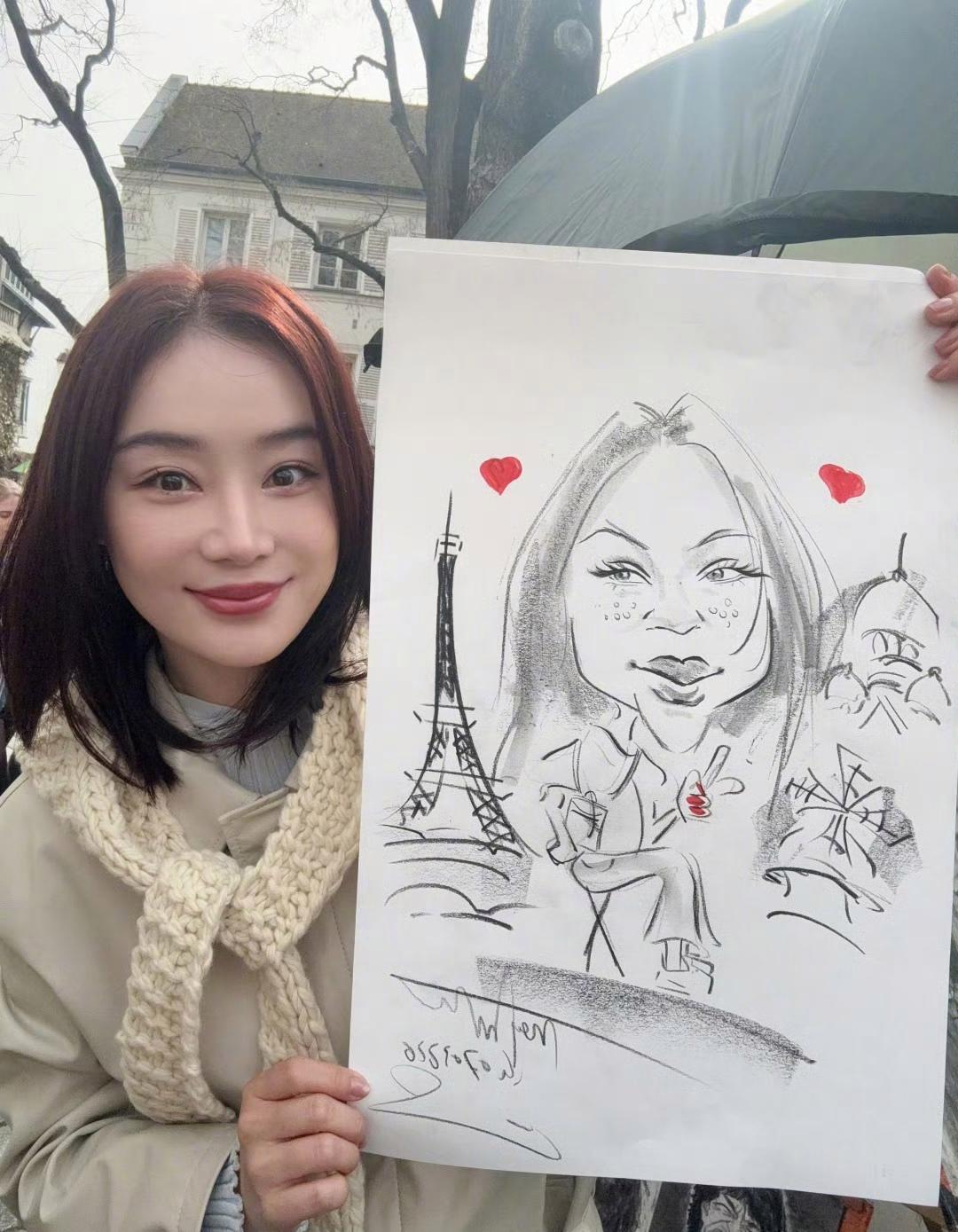 袁姗姗在个人账号晒出了一组穿风衣的美照，看照片中的风景，这是在巴黎呀……景美人美