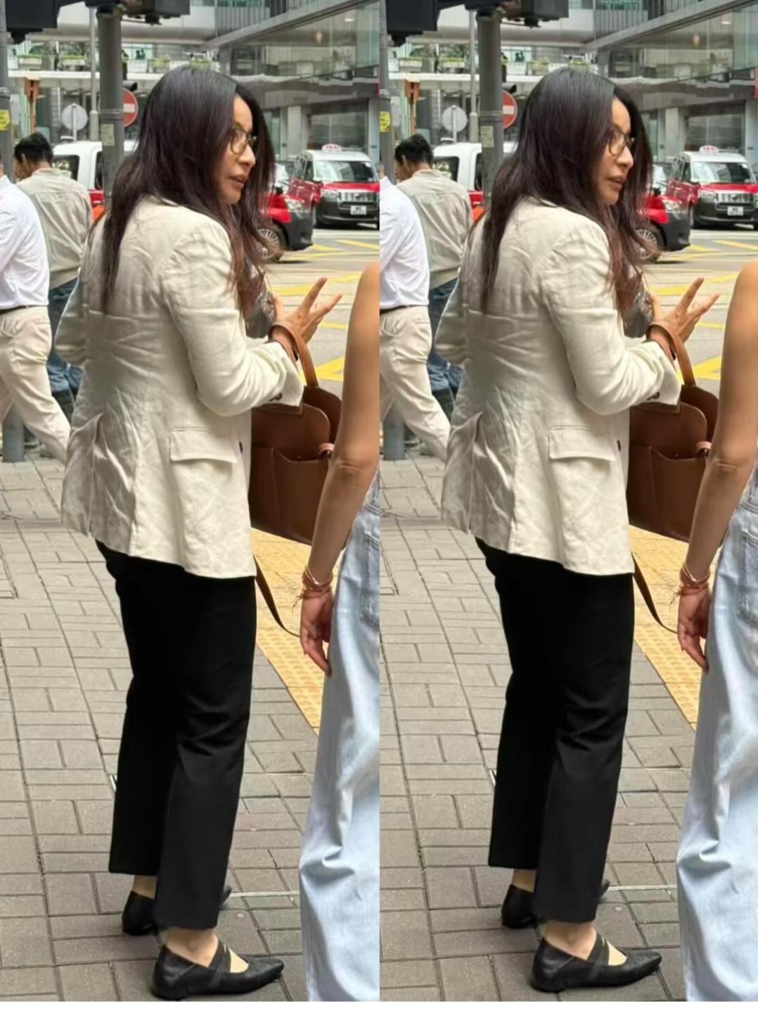 郭晶晶，好不精神。是头发太长了，还是衣服褶子太多了？