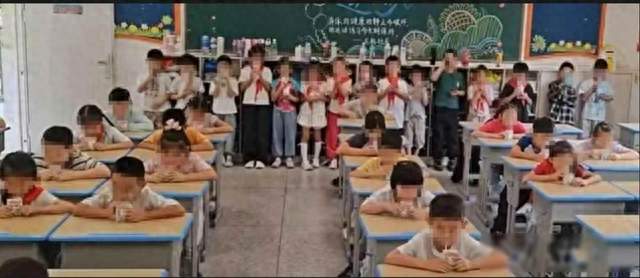 武汉一小学被指“订奶学生坐着喝奶，没订奶罚站喝水”