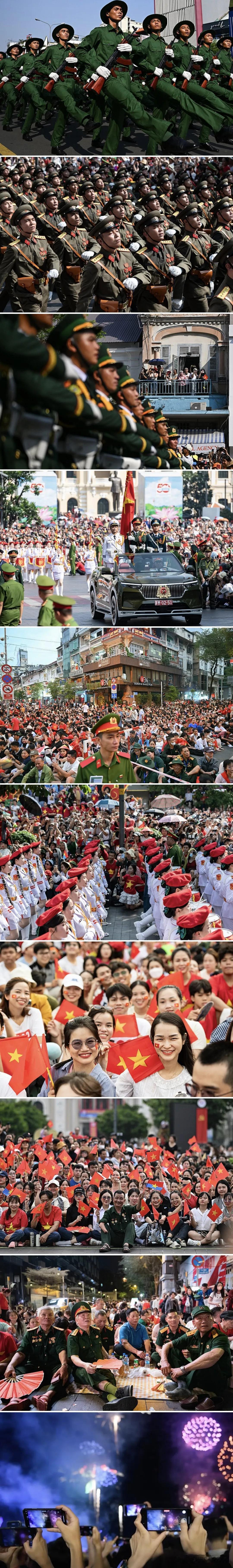 4月30日，人们在胡志明市参加纪念越南统一50周年游行。

游行沿着乐端街开始，