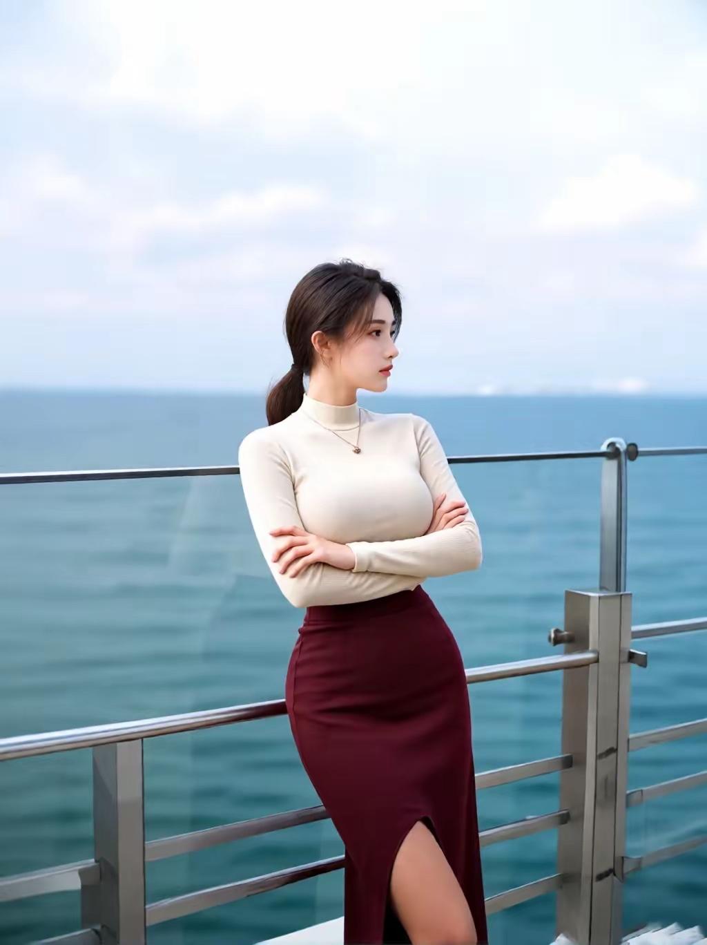 海边漫步真的是超棒的体验！想象一下，一个身着浪漫红裙的少女走在海边，微风轻轻拂过