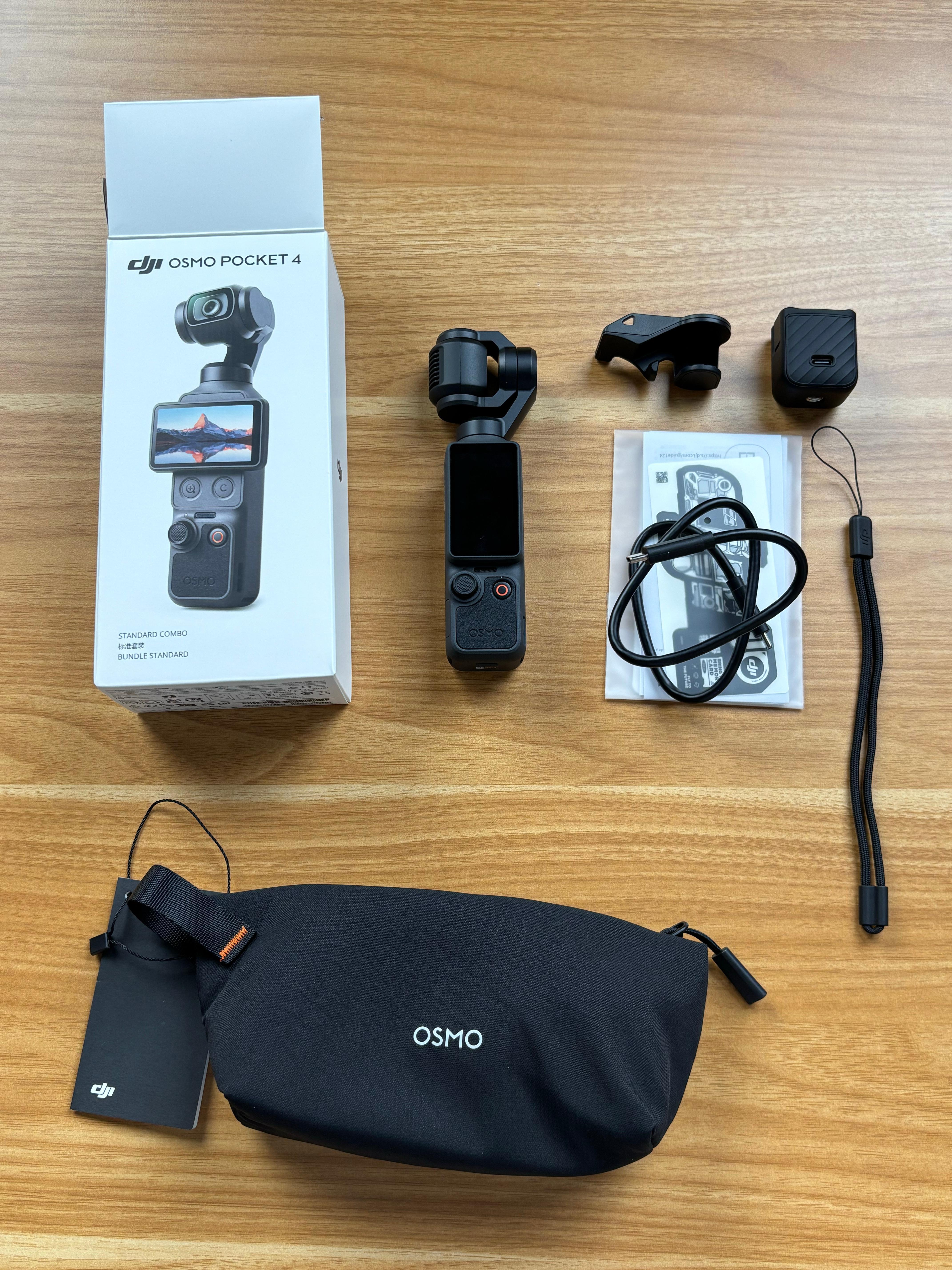 同事刚刚开箱了大疆 Pocket4，作为 Pocket3 旧用户，她表示不会升级