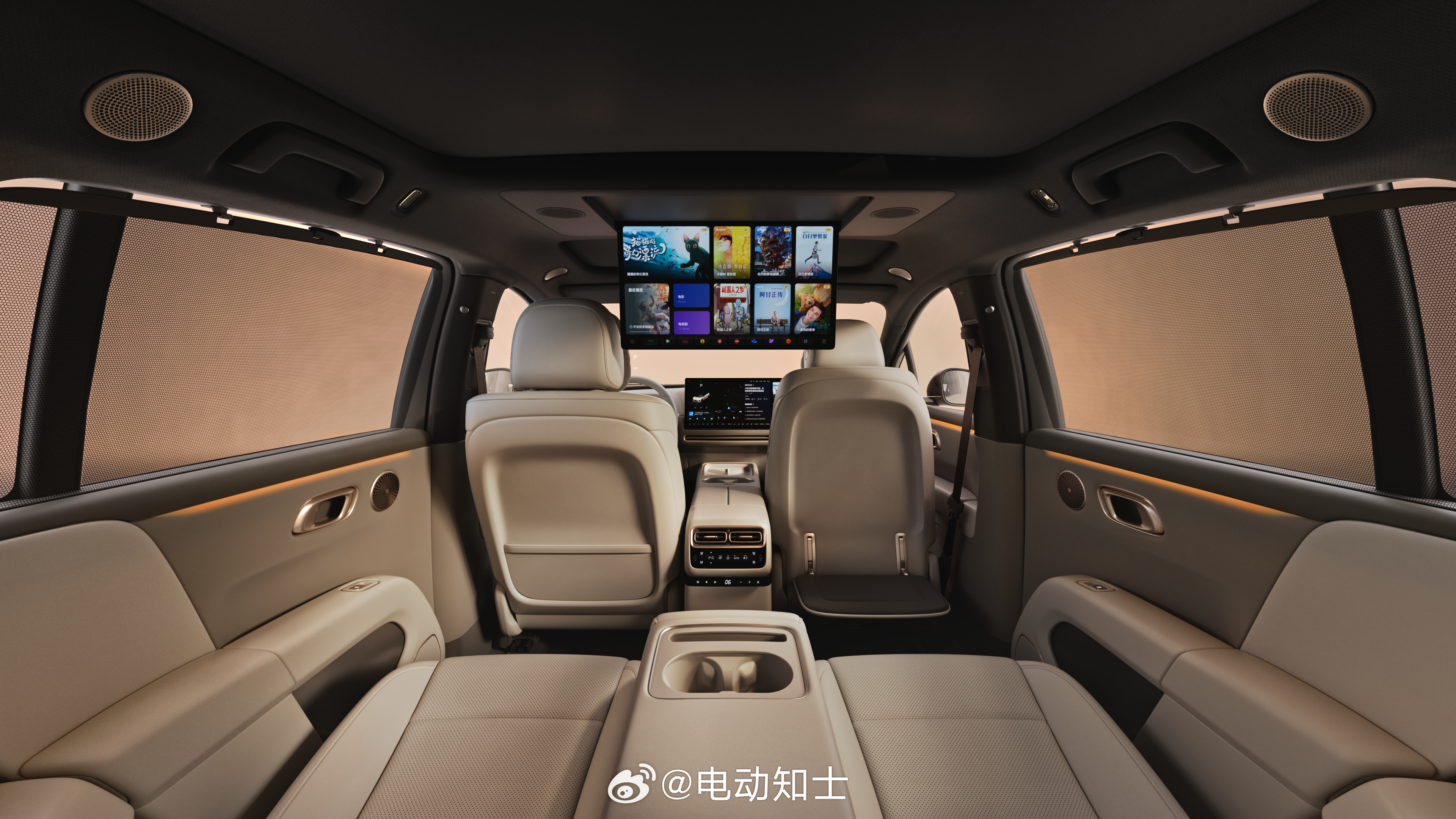 理想i6车内官图，有冰箱、二排21.4寸娱乐屏，屏幕上是宇宙探索编辑部...