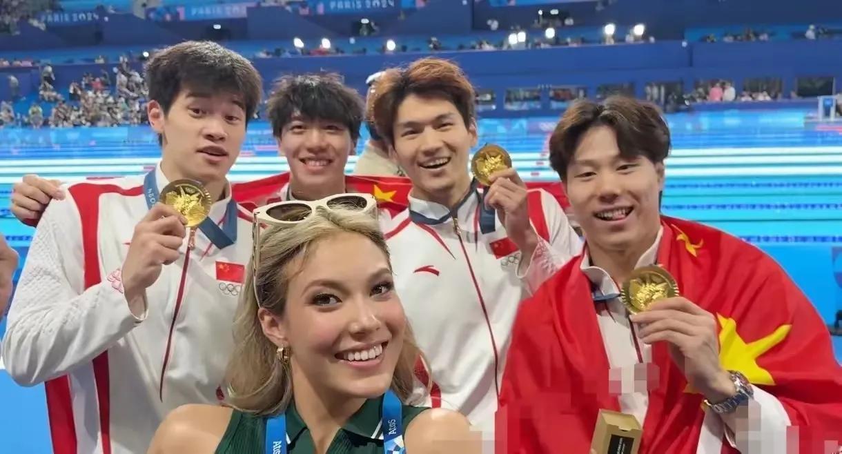 谷爱凌与潘展乐合影，问题来了，谷在中国是中国人，在美国是美国人，在法国是什么人？