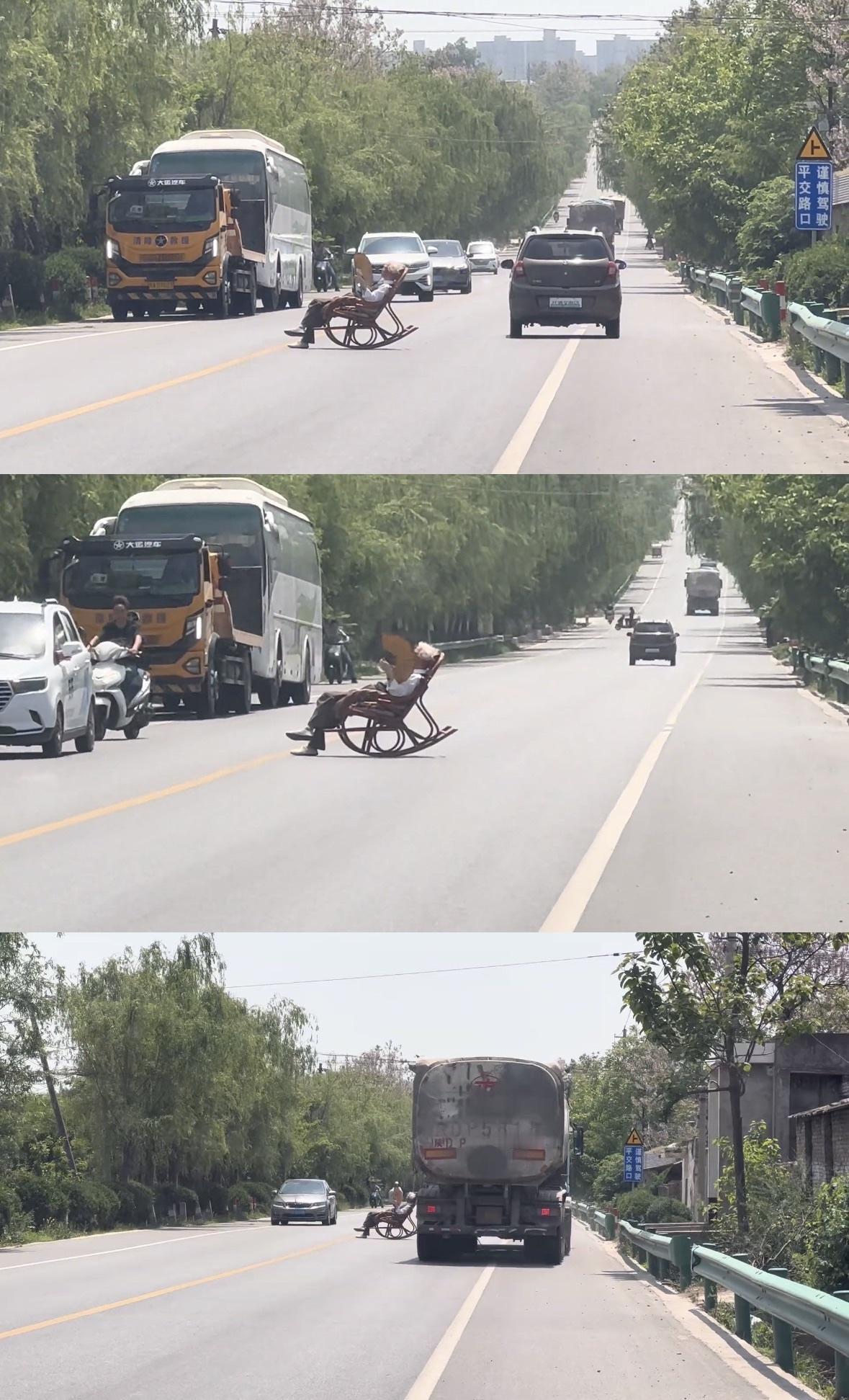 车主反映陕西一大爷马路中间晒太阳，来往车辆纷纷躲避。

陕西一大爷将摇椅搬到马路