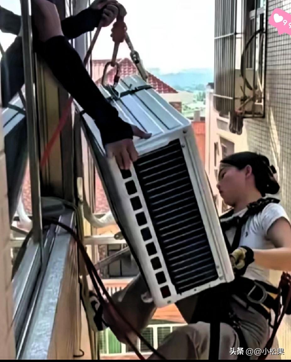 火上人民日报！广东这对年轻夫妻看哭无数人，妻子绑绳爬窗外装空调，动作熟练到让人心