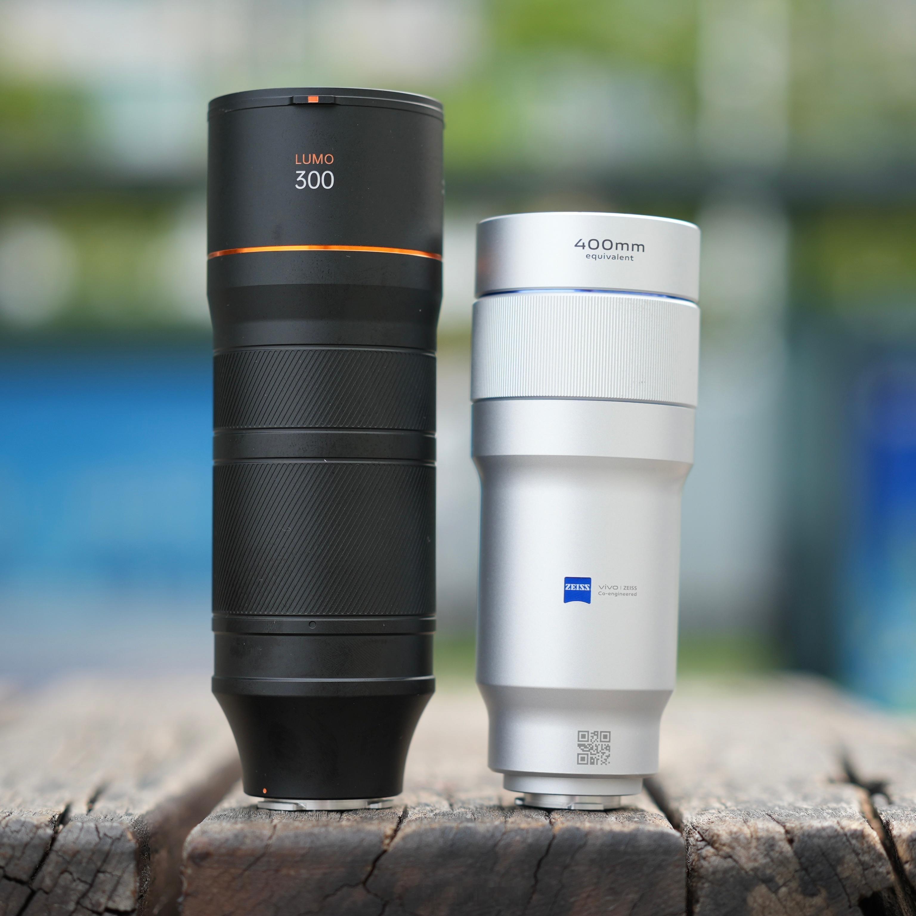 A手机依旧做不好增距镜，单独一个增距镜模式，只能拍1200万低像素；B手机做的不