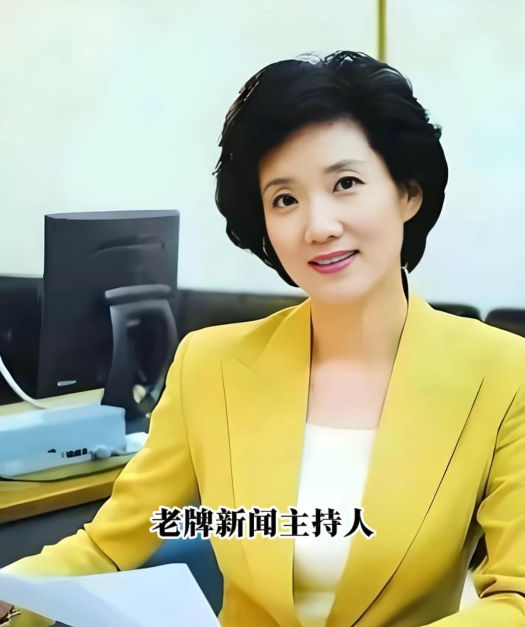 这位大姐穿黄色西装，坐在办公室里。她真的很漂亮。你还记得她的名字吗？感觉他们还没