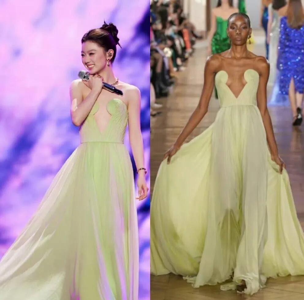 单依纯穿上这一条浅绿色的礼服裙，感觉没有模特有气质。单依纯是清纯，眉目清秀的，穿