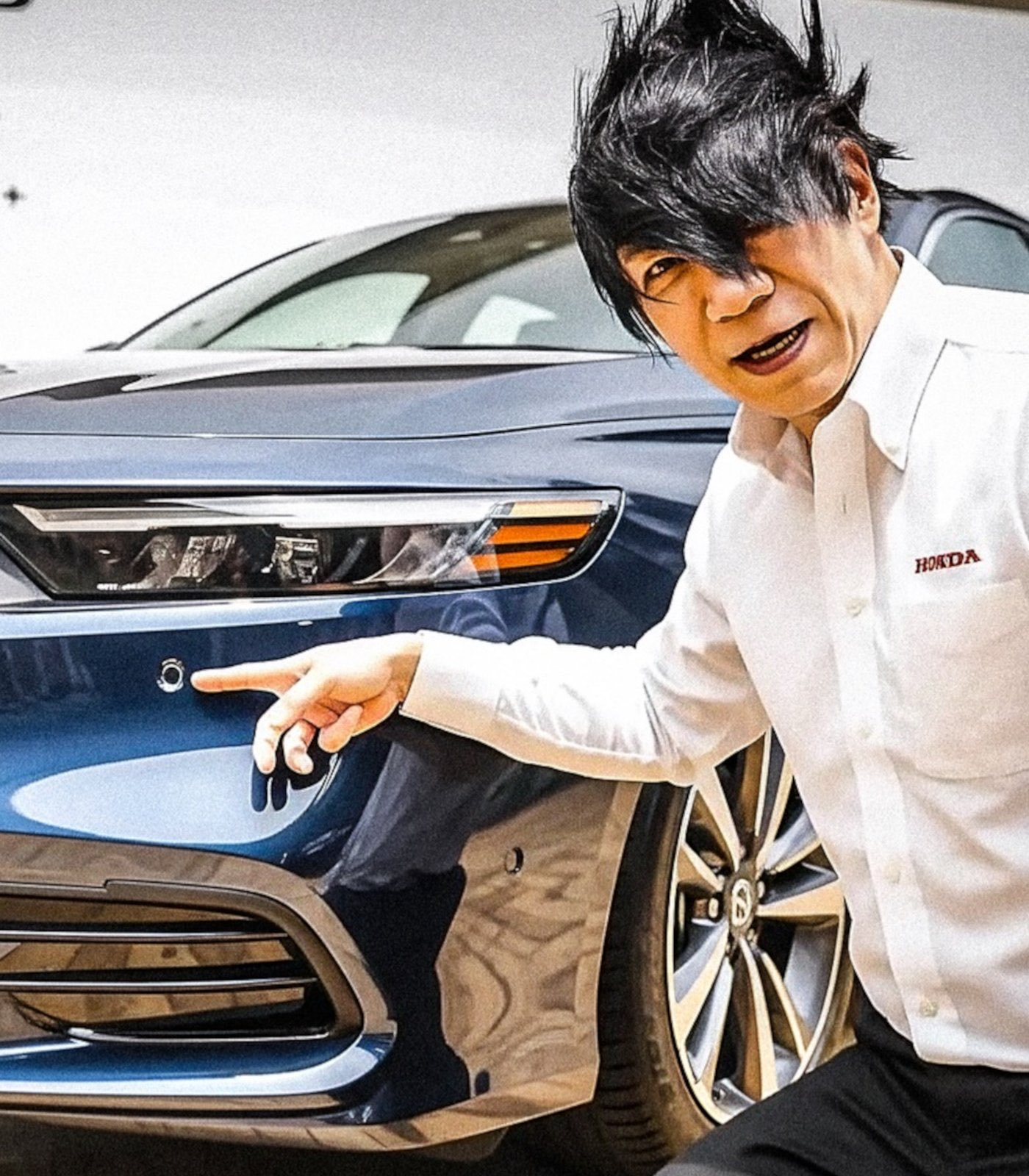 这个留着日本ACG雷人发型的大叔，是本田的技术官 