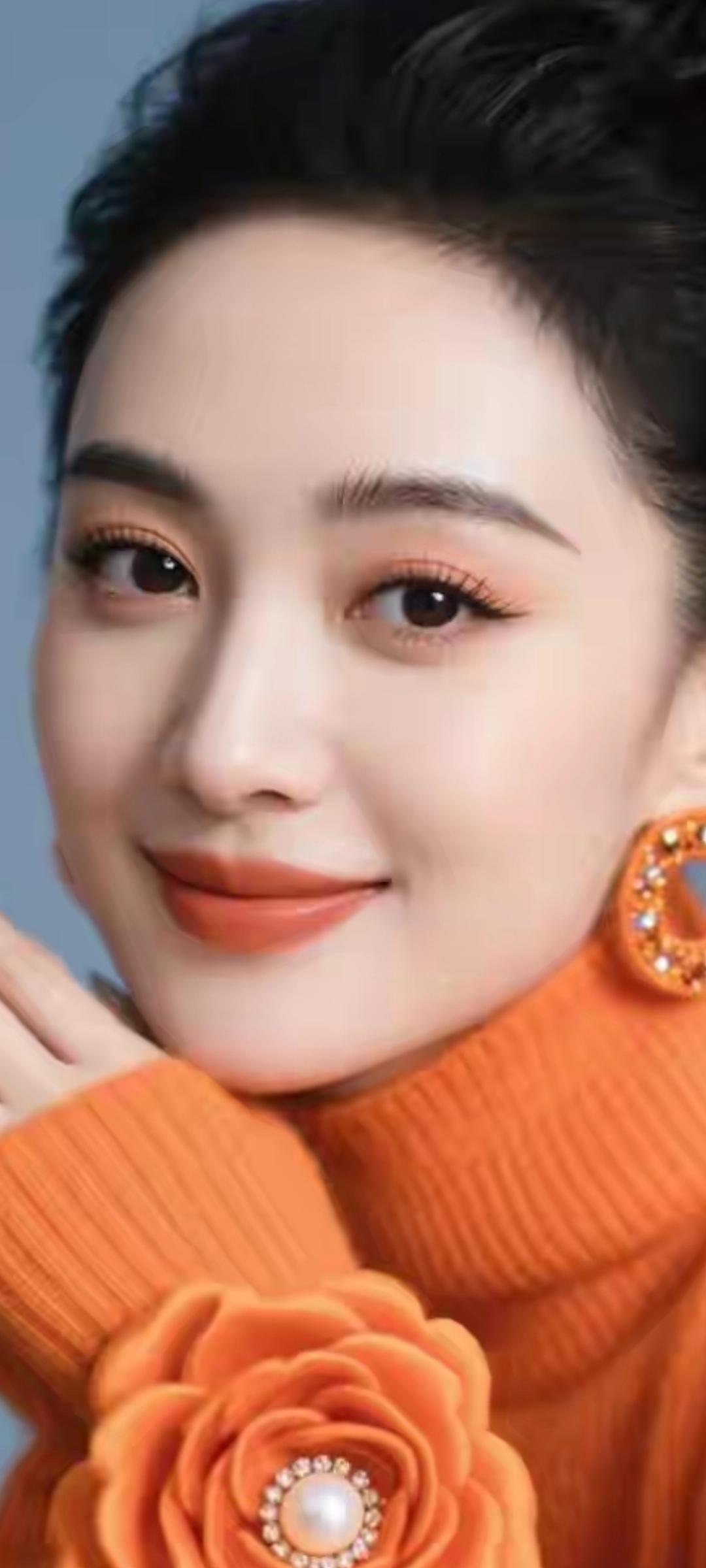 温柔甜美的橙色毛衣，搭配珍珠耳环，尽显优雅气质！🌟✨