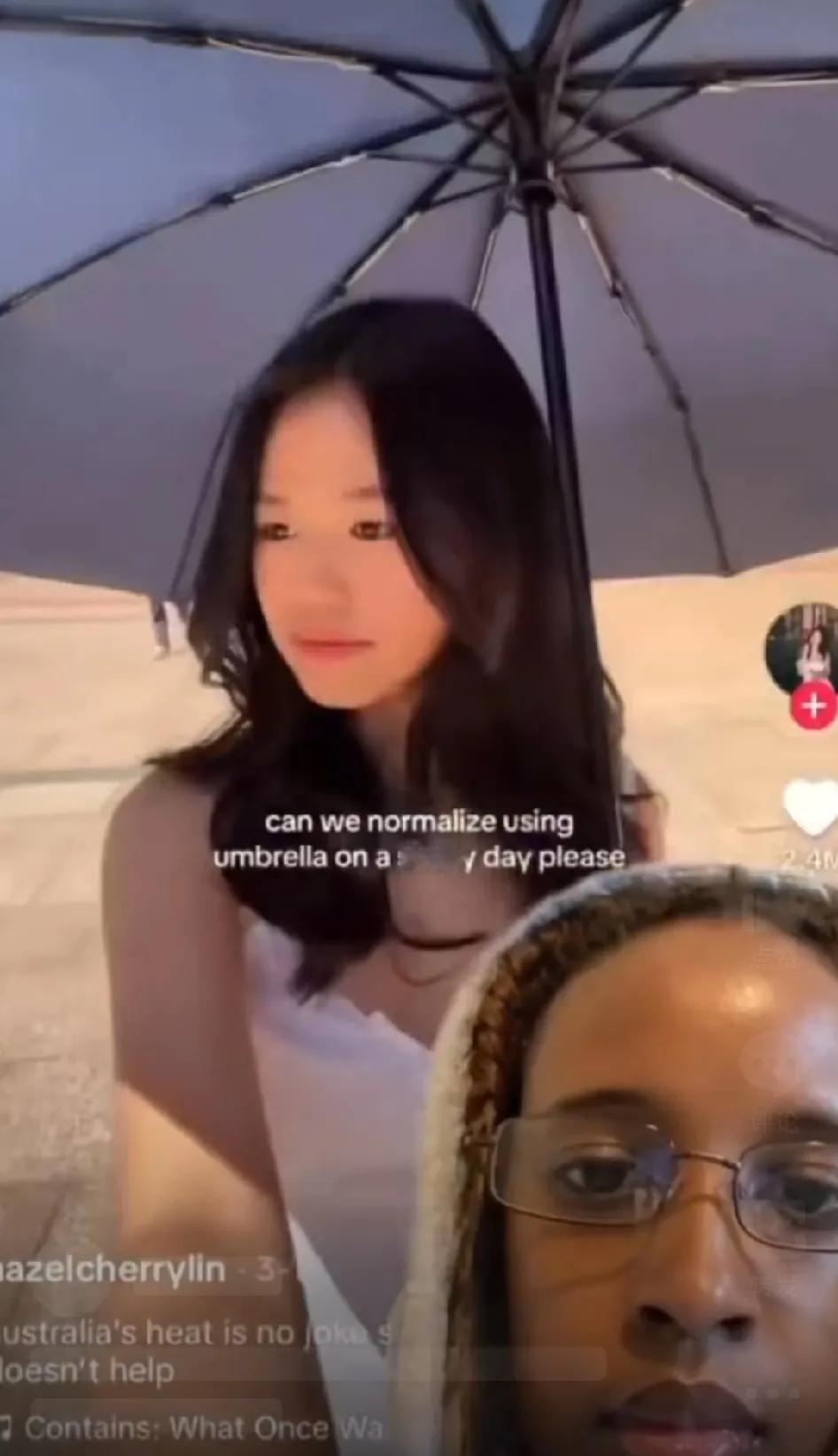 又一个闲得无事找抽的。

一非洲女子看到亚洲女人为了不被晒黑而打遮阳伞，竟然又触