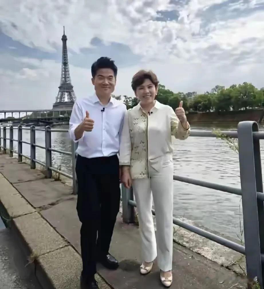 矮个子有大能量，一男一女两位能人在巴黎相遇，并在塞纳河畔进行了合影。
奥运会因他