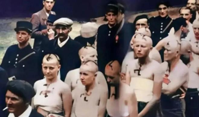 1945年，巴黎街头，几名漂亮的女子被剃光头发，剥光衣服，赤裸站在大街上，一群法