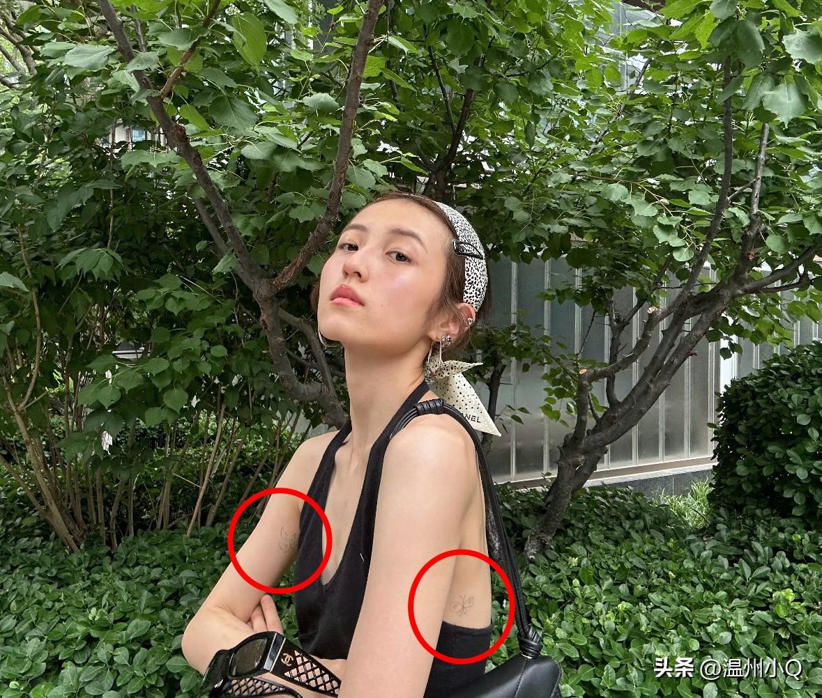 感觉张子枫不像是会去纹身的女孩子，她身上的几处淡淡的图案更像是用圆珠笔画上去的。