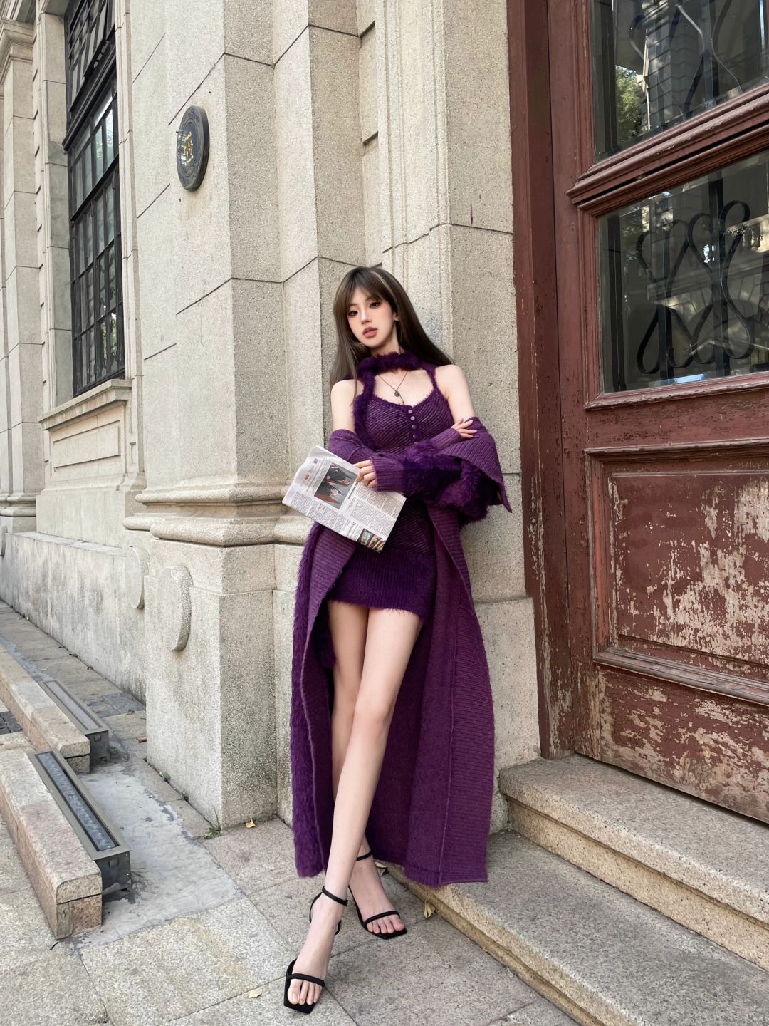She has got a purple doll.
