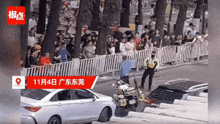 辅警当街殴打真警察？”广东东莞，一名身着辅警制服的男子开车闯了个红灯，被交警铁骑