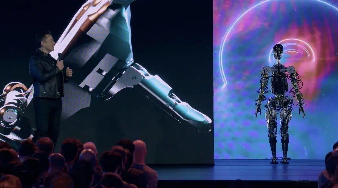 惊艳！当五台Optimus机器人伴着音乐翩翩起舞，戴着牛仔帽的机型熟练客串调酒师