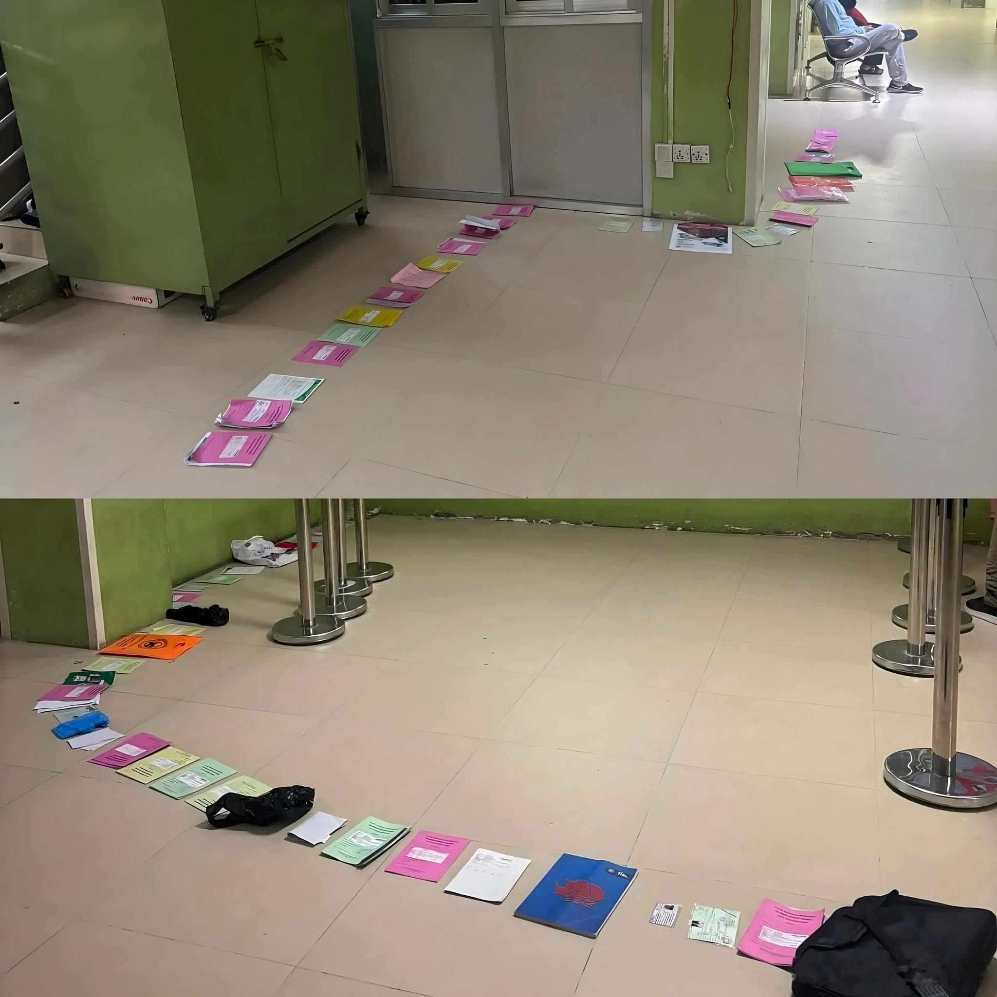 尼泊尔公民医院每天早上实况，地板上铺一长排彩色纸当号位，患者就这么排着队等门诊票