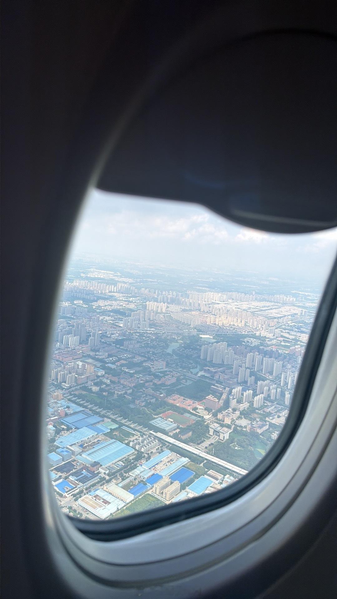 今天又要坐白天的飞机了 今天飞机上我要清理我的相册 