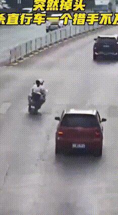 十字路口红灯亮着，一年轻小伙骑着电动车带着女友，没留神径直闯了过去。刚骑到路中间