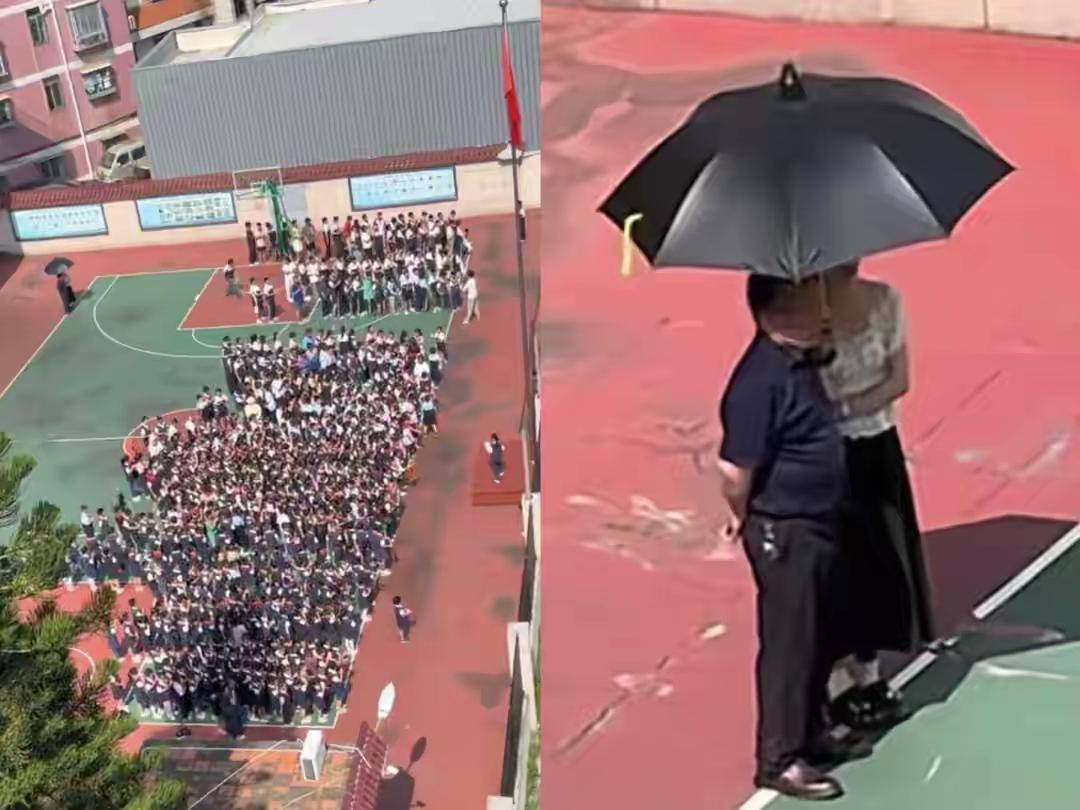被福建某学校操场这画面给震撼，一个男老师手背后面，严肃的站着看同学们表演，身旁站