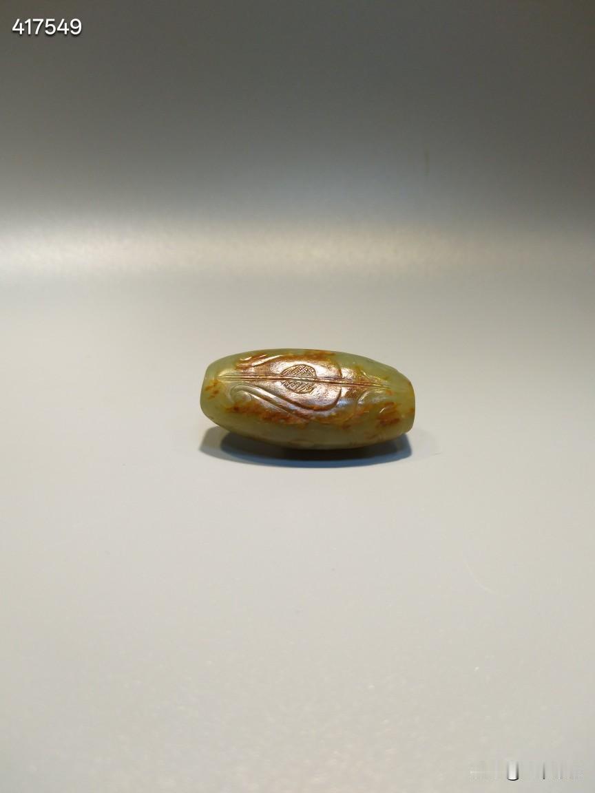 兽面纹.玉勒
流行于:商周
和田黄玉红沁