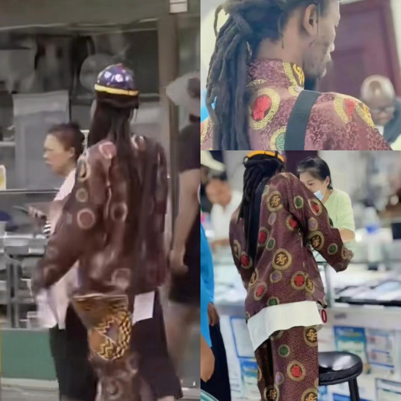 不得不说，
要不是知道那是寿衣，
还觉得挺好看的，被一个黑人穿着招摇过市，也不知