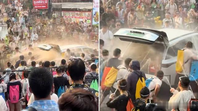 女子被强拉开车门泼水车内部冒烟这种行为已远超节日玩笑，严重威胁人身与财产安全，明