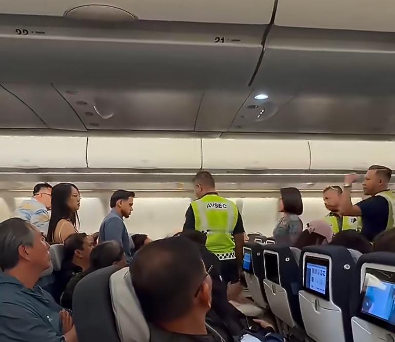 这事看起来挺丢人的。马来西亚某航班，一名说华语的男旅客用手拍了一名女子的屁股，女