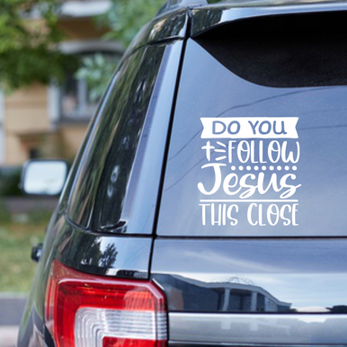 哈哈这个车贴有意思：Do you follow Jesus this close