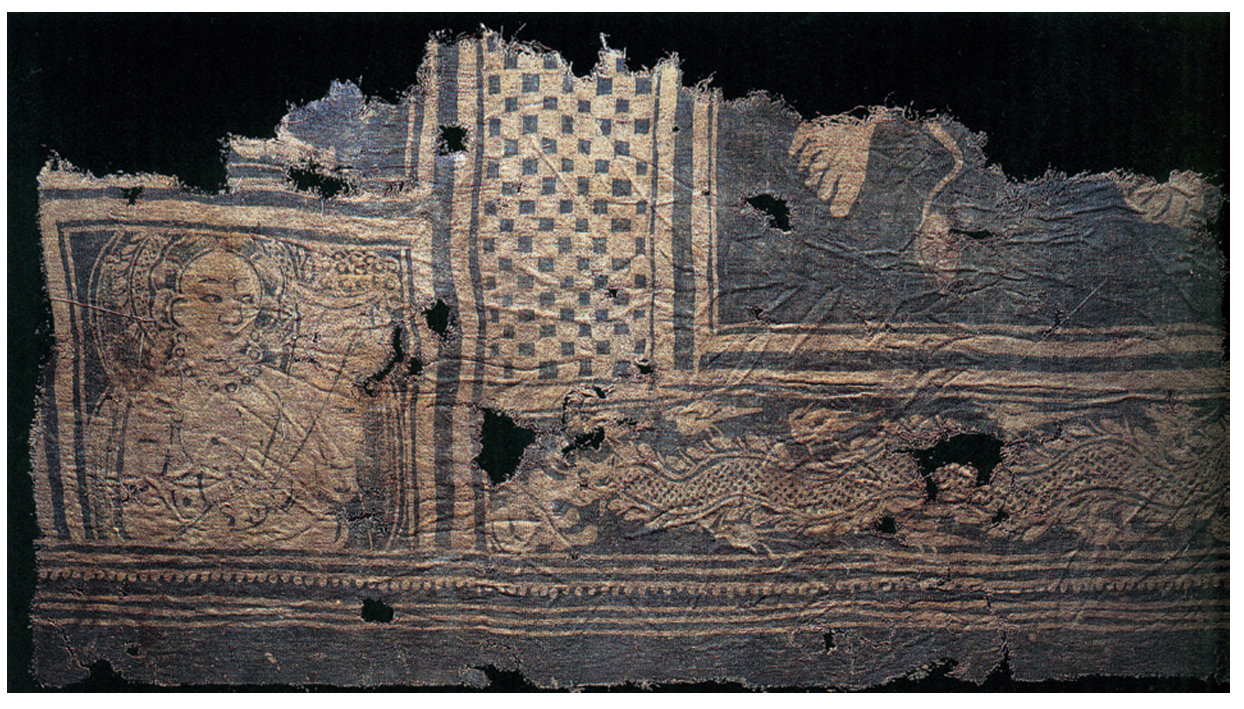 新疆尼雅遗址公元2世纪东汉晚期墓葬出土蓝白印花棉布残片，图案是“丰收女神”。有观