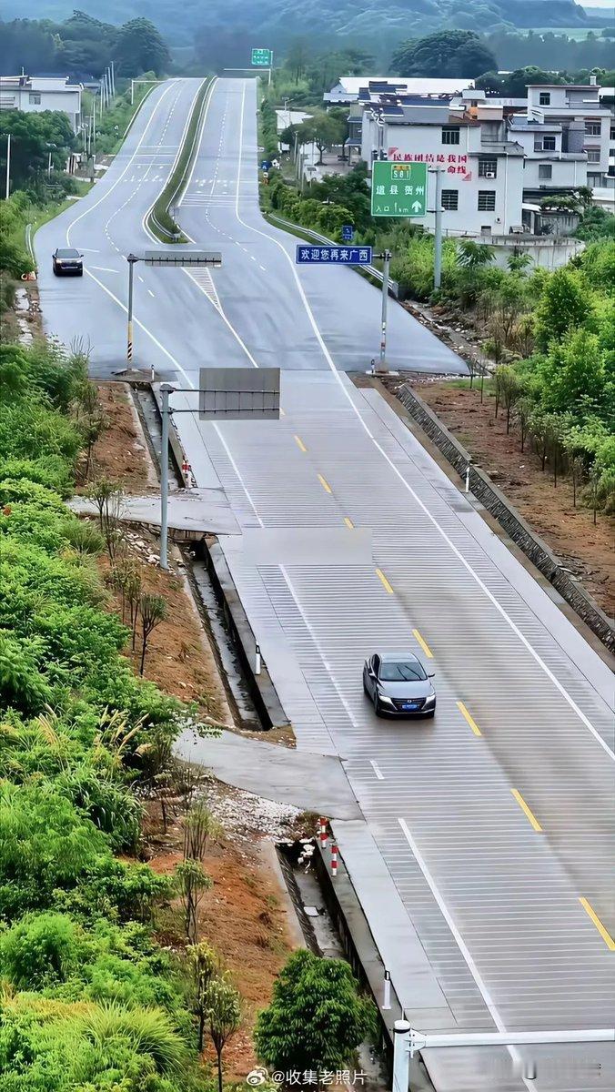 开国道路过湘桂交界，一张图就能看出两边路况差别。
湖南段平整宽阔柏油路，车道规整