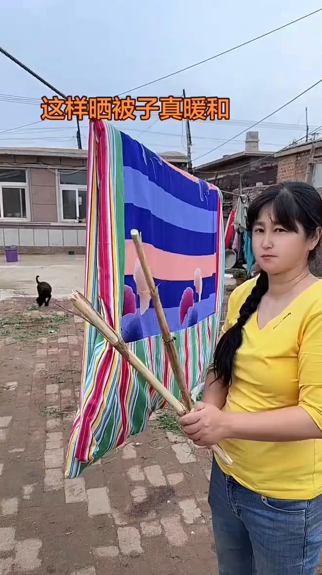 这样晒被子真暖和。
如果不是亲眼所见我是万万不敢相信。