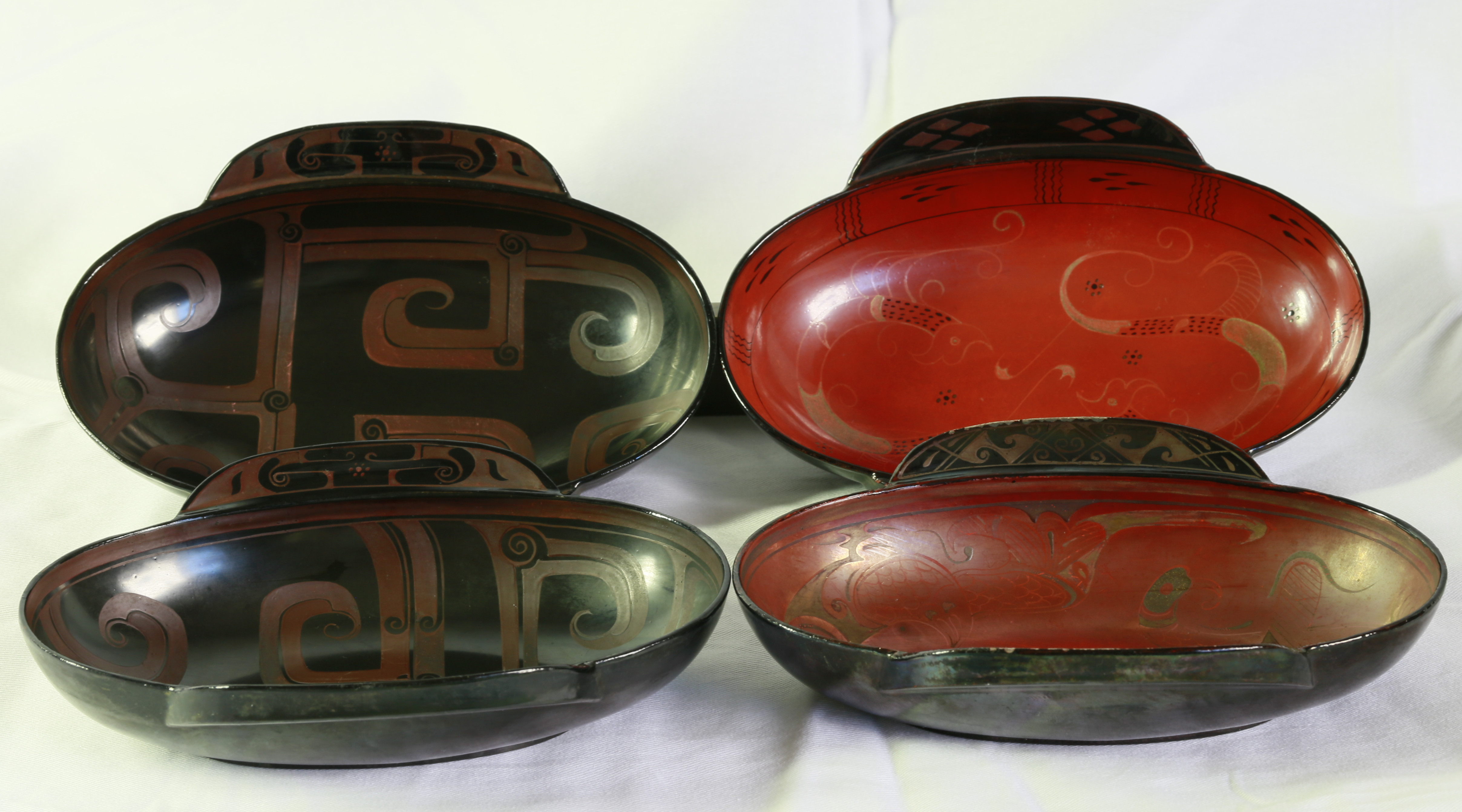 西汉 . 漆器漆耳杯四件（四件一套）尺寸：长174.5MM，宽128MM，高48