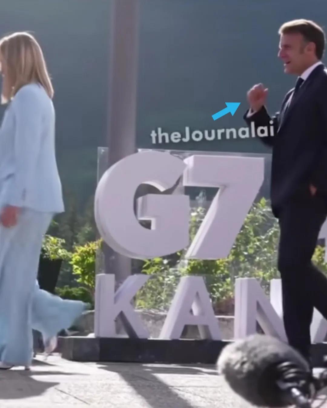 G7峰会中梅洛尼和马克龙一前后前行。