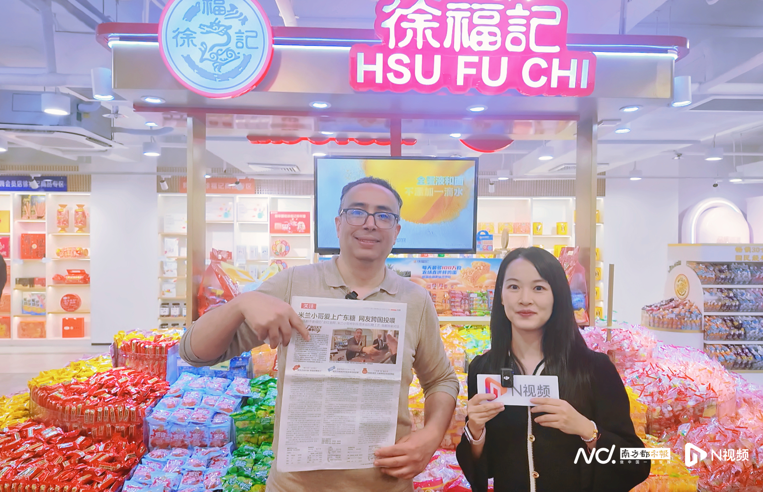 #米兰小哥获赠南都报纸要带回意大利#【米兰小哥获赠记录跨国送糖故事的南都报纸！称