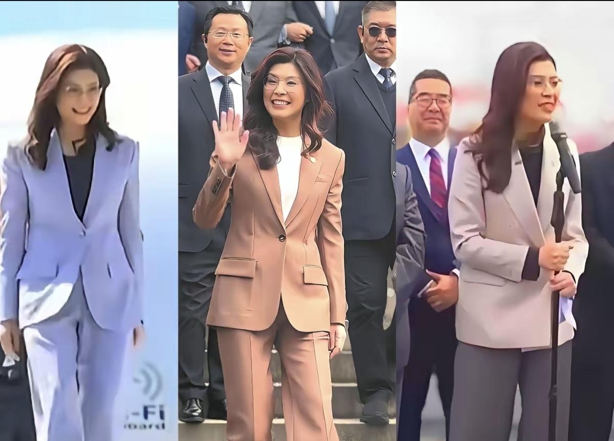 郑丽文第一天穿的西装是浅紫色，她笑意盈盈的样子清爽又甜美；
郑丽文第二天穿的西装