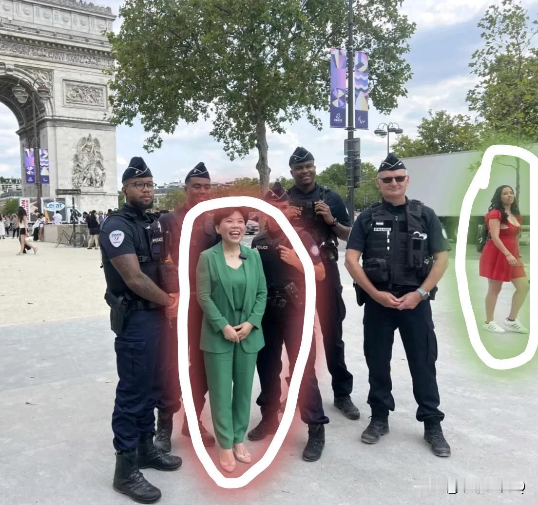某奥运大明星现身法国！她的衣服挺吸睛啊！怪不得法国警察找她合影！我是被他们身后那