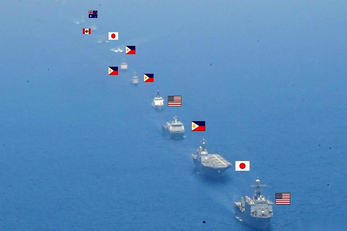 日本自卫队，发了张照片。
地点，就在咱们家门口。照片里，美日菲三家凑在一起，一堆