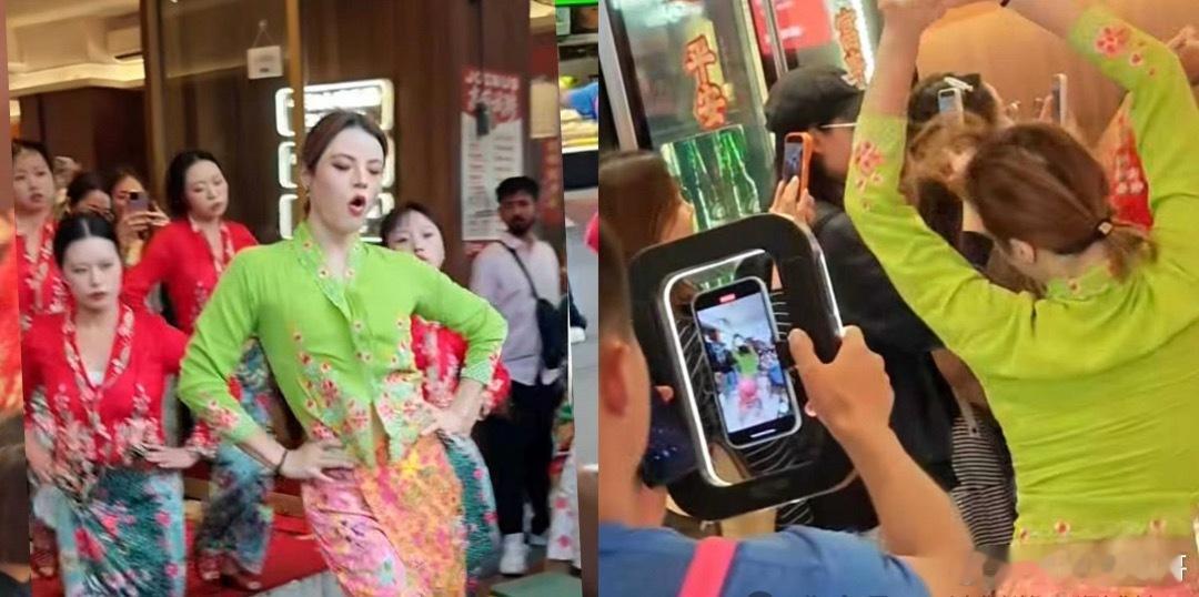 中国长沙弗兰舞团和领舞者“神童童”身穿娘惹服，8月26日在牛车水一家中式餐馆和街